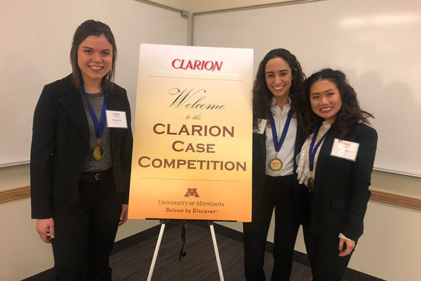 The three members of the winning team at the 2019 local case competition